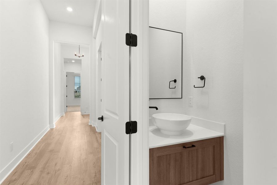 Bathroom featuring vanity, light wood-type flooring, and recessed lighting Bathroom featuring vanity, light wood-type flooring, and recessed lighting