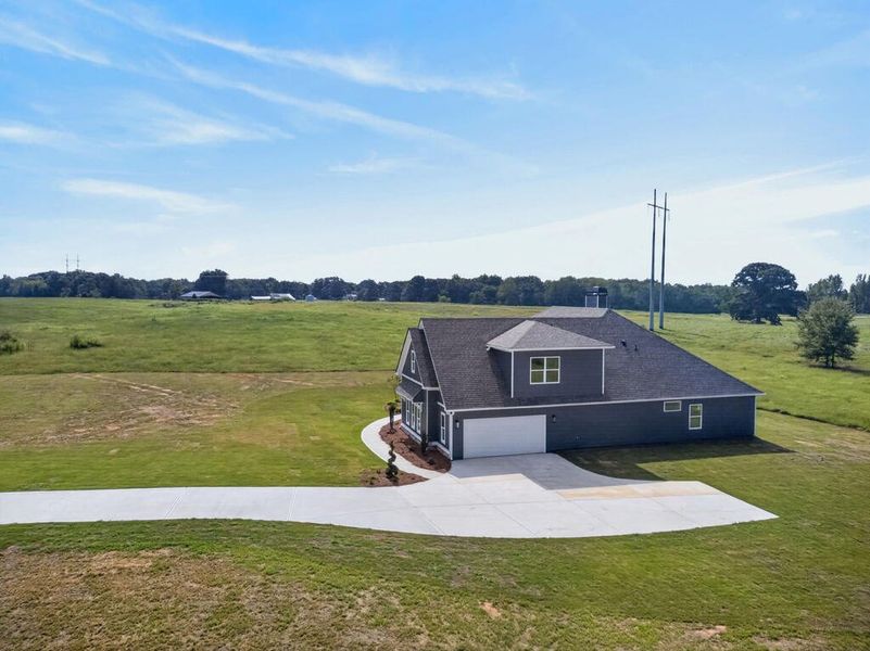 Front exterior of a new home in Veal Meadows, Roopville, GA, highlighting curb appeal (Image 29). Front exterior of a new home in Veal Meadows, Roopville, GA, highlighting curb appeal (Image 29).