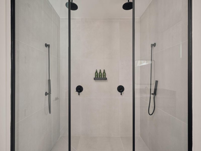 Double shower heads in primary shower