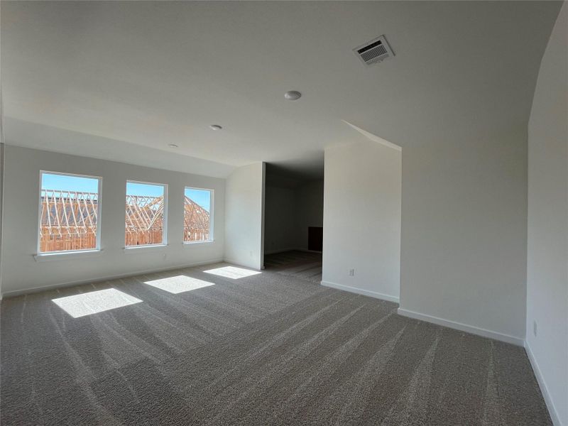 The game room opens directly to the media room, creating a seamless entertainment space. This layout is perfect for hosting gatherings or enjoying family movie nights.