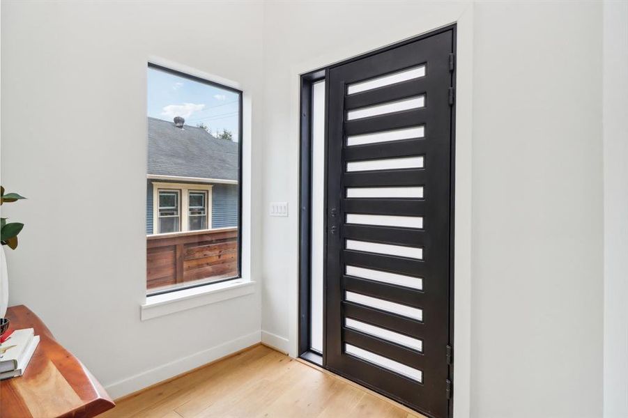 Beyond the steel entry door is a bright and sunny foyer.