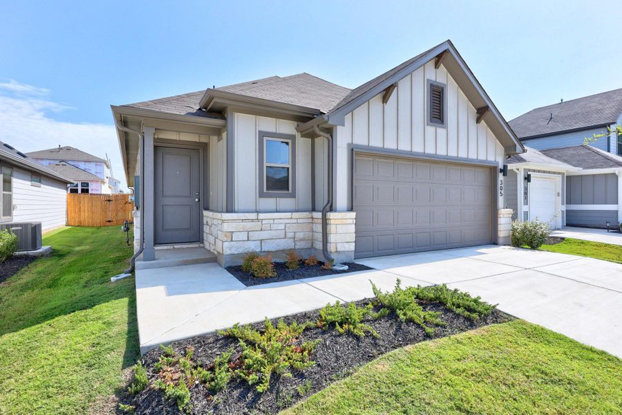 Front exterior of a new home in Trinity Ranch, Elgin, TX, highlighting curb appeal (Image 22).