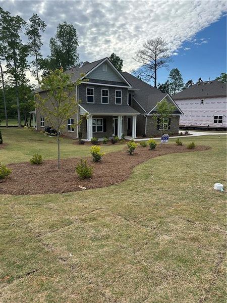 Front exterior of a new home in Mirror Lake at South Harbour, Villa Rica, GA, highlighting curb appeal (Image 26).
