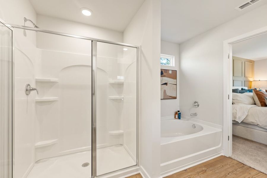 A bathroom with a glass shower. A bathroom with a glass shower.
