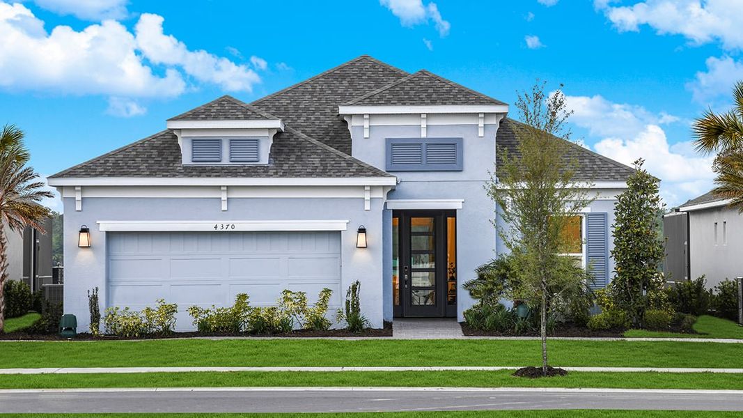 Representative exterior photo of a completed home built from the Lazio by Taylor Morrison in Esplanade at Westview, Kissimmee, FL (Image 1).