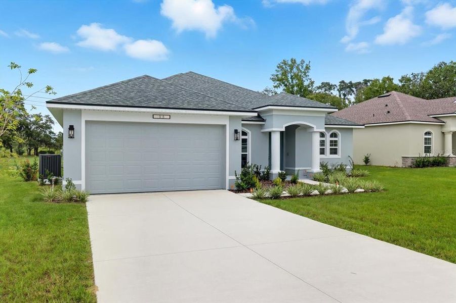 Front exterior of a new home in , Homosassa, FL, highlighting curb appeal (Image 1).