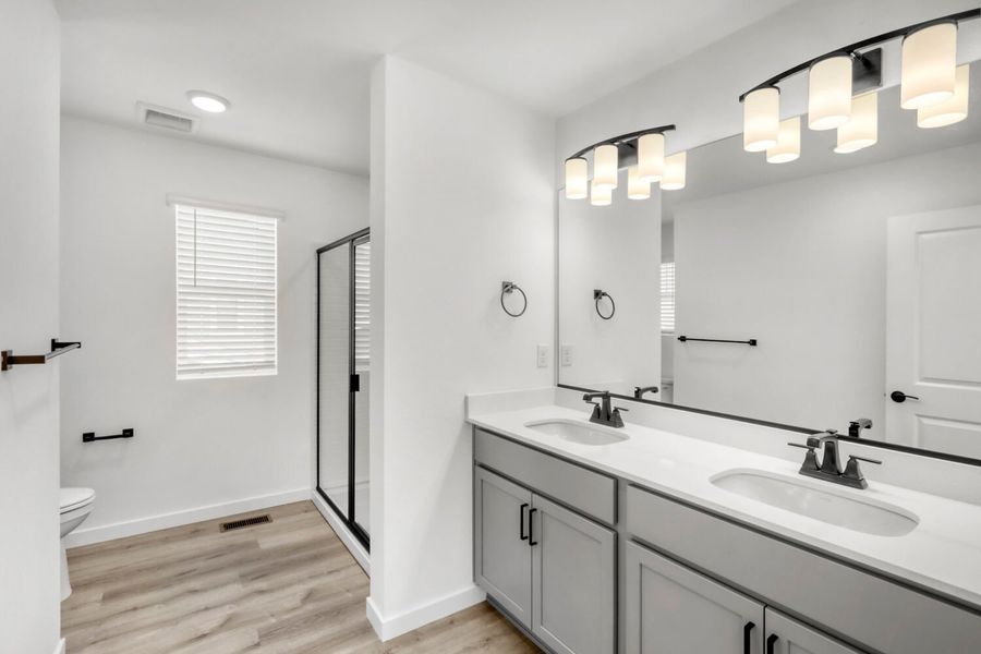 Furnished interior view inside a new home in Barefoot, Firestone (Image 4).