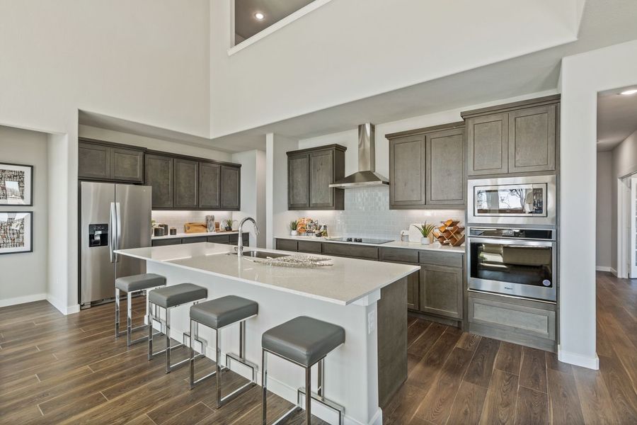 Kitchen in the Mercury II home plan by Trophy Signature Homes – REPRESENTATIVE PHOTO