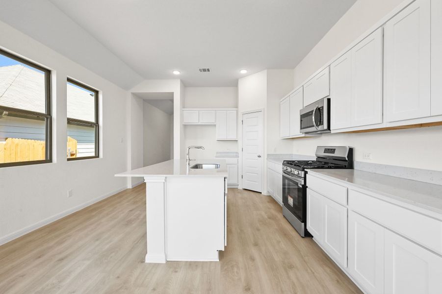 Kitchen in the Cedar home plan by Trophy Signature Homes – REPRESENTATIVE PHOTO