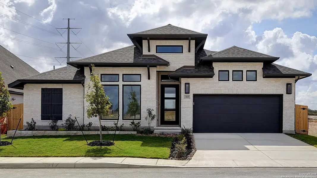Front exterior of a new home in Haby Hill 60', San Antonio, TX, highlighting curb appeal (Image 1). Front exterior of a new home in Haby Hill 60', San Antonio, TX, highlighting curb appeal (Image 1).