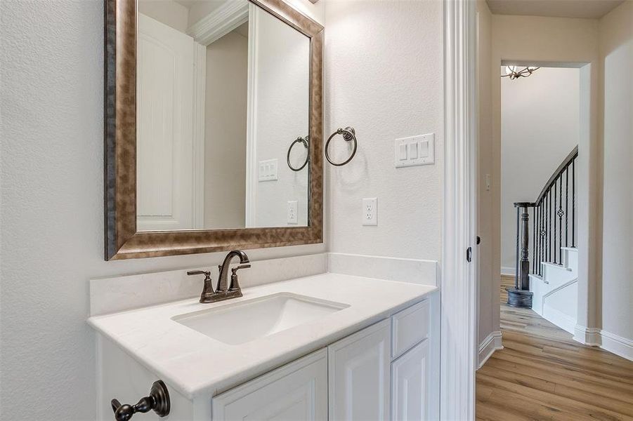 Bathroom featuring hardwood / wood-style floors and vanity