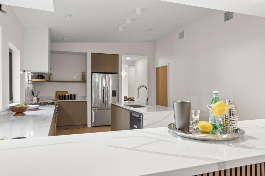 Modern kitchen with granite countertops and stainless steel appliances. Modern kitchen with granite countertops and stainless steel appliances.