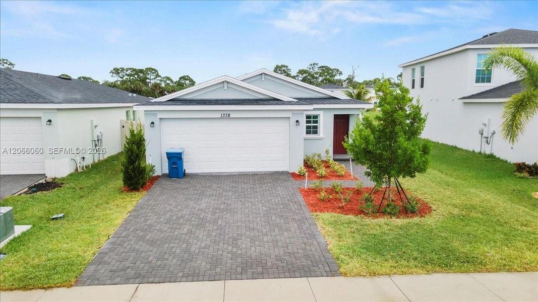 Front exterior of a new home in , Palm Bay, FL, highlighting curb appeal (Image 2). Front exterior of a new home in , Palm Bay, FL, highlighting curb appeal (Image 2).