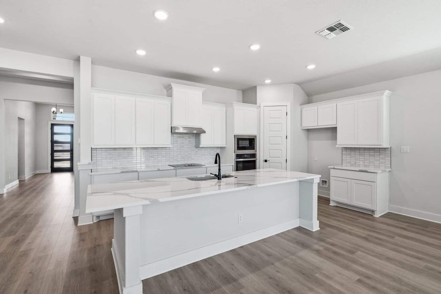Representative furnished interior of a home built from the Mackenzie by Chesmar Homes in Sienna Lakes, San Antonio (Image 4).