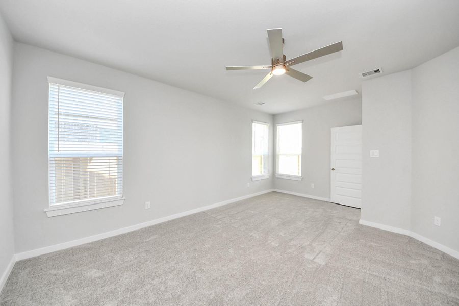 Another perspective unveils a comprehensive view of the serenity and comfort this primary suite offers. Sample photo of completed home with similar floor plan. Actual colors and selections may vary. Another perspective unveils a comprehensive view of the serenity and comfort this primary suite offers. Sample photo of completed home with similar floor plan. Actual colors and selections may vary.