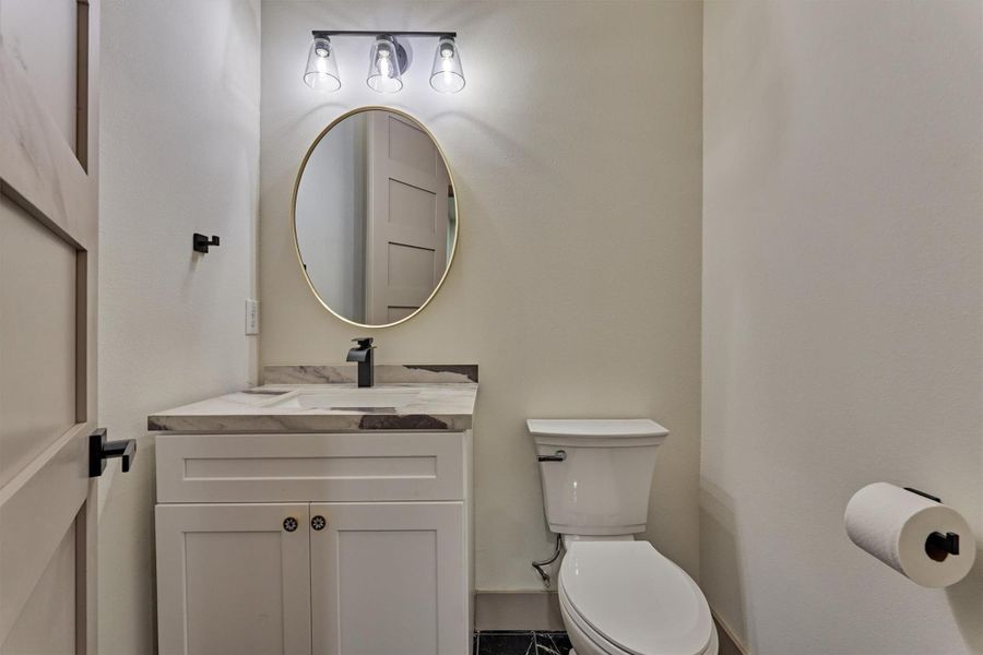 Half bath easily accessible from garages or kitchen