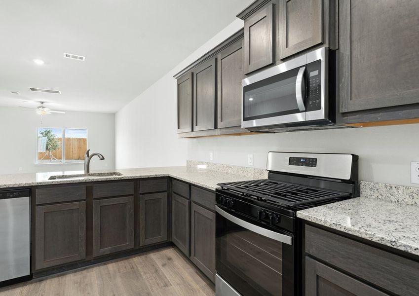 The kitchen of the Driftwood has stainless-steel appliances. The kitchen of the Driftwood has stainless-steel appliances.