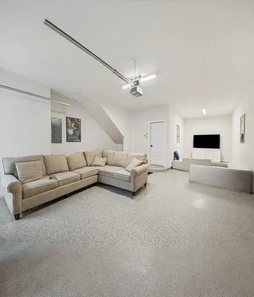 Interior shot of the three car garage! endless possibilities for a workout room, car gurus, golf simulator, and more! Interior shot of the three car garage! endless possibilities for a workout room, car gurus, golf simulator, and more!