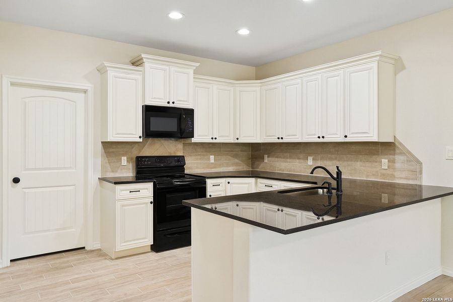 Furnished interior view inside a new home in , Seguin (Image 6).