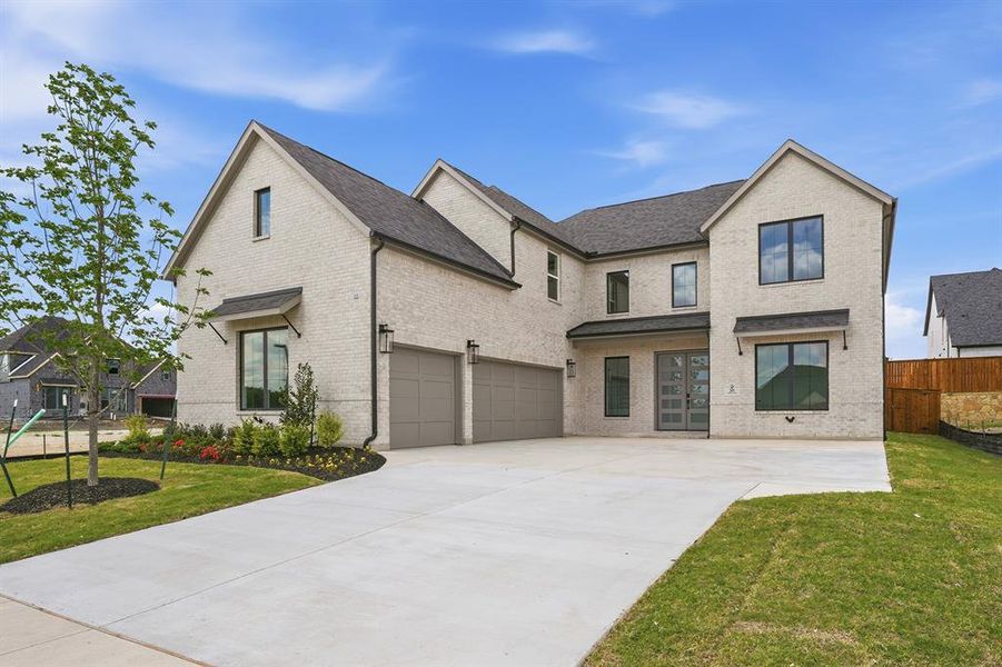 Front exterior of a new home in Custer Ridge Estates, Allen, TX, highlighting curb appeal (Image 2). Front exterior of a new home in Custer Ridge Estates, Allen, TX, highlighting curb appeal (Image 2).