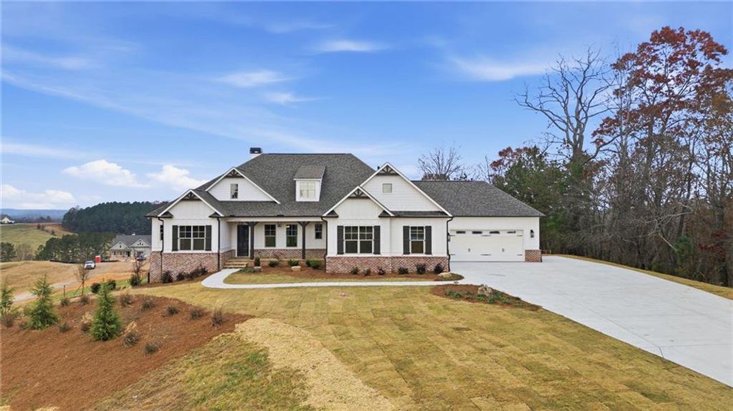 Front exterior of a new home in , Gainesville, GA, highlighting curb appeal (Image 1).