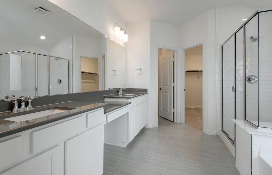 Double vanity and large shower in owner's bath