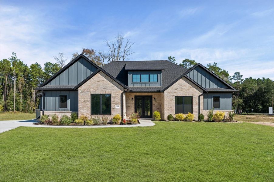 Front exterior of a new home in , Conroe, TX, highlighting curb appeal (Image 2).