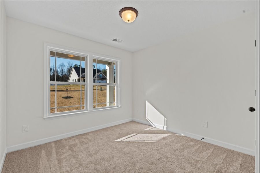 Representative unfurnished interior of a home built from the Cheshire by Enchanted Homes in Hampshire Heights, Moore (Image 17).