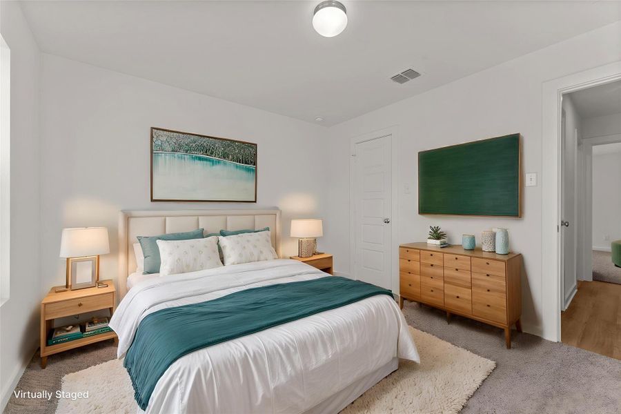 A tranquil bedroom provides comfort with soft lighting and a plush rug, creating a serene personal retreat.