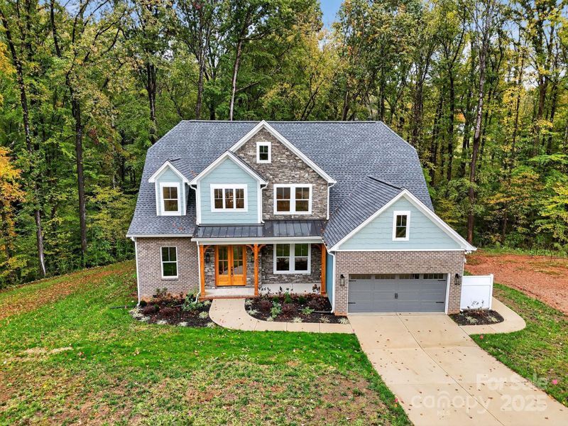 Front exterior of a new home in , Belmont, NC, highlighting curb appeal (Image 1).