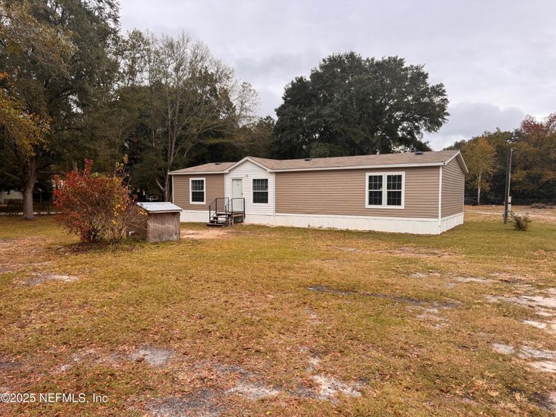 Exterior details and patio area of a home in , Fernandina Beach (Image 1).