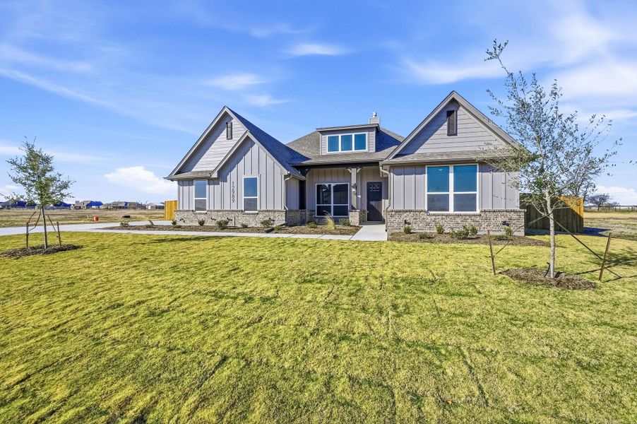 Front exterior of a new home in Coyote Crossing, Godley, TX, highlighting curb appeal (Image 26).
