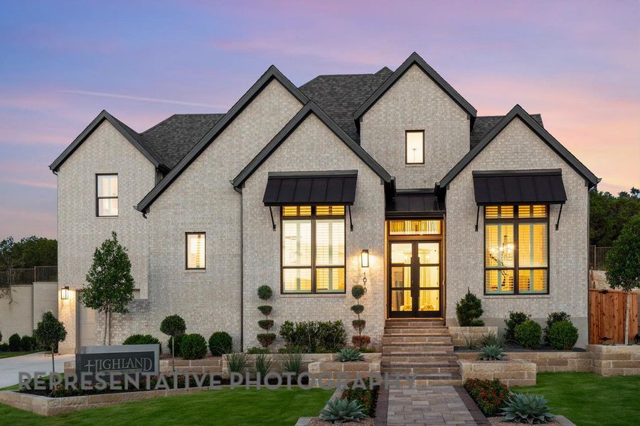 View of front facade featuring french doors, a standing seam roof, and roof with shingles View of front facade featuring french doors, a standing seam roof, and roof with shingles