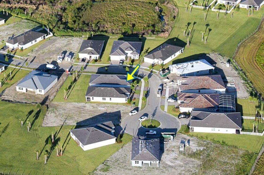 Front exterior of a new home in Del Webb Tradition, Port St. Lucie, FL, highlighting curb appeal (Image 15).