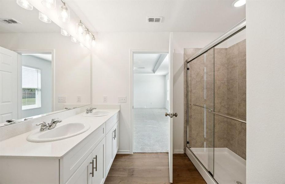 Owner's private bath with double vanity