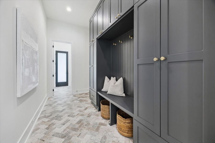 MUD room with Brick Paver flooring, lockers and convenient storage. MUD room with Brick Paver flooring, lockers and convenient storage.