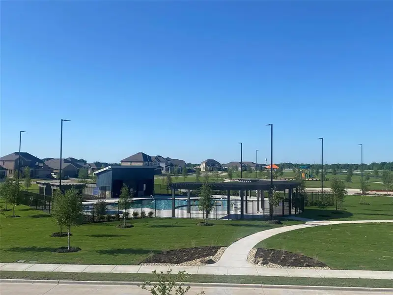 Front exterior of a new home in Coyote Meadows, Anna, TX, highlighting curb appeal (Image 2). Front exterior of a new home in Coyote Meadows, Anna, TX, highlighting curb appeal (Image 2).