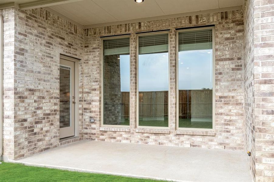 Exterior details and patio area of a home in ArrowBrooke Classic 50, Aubrey (Image 22).