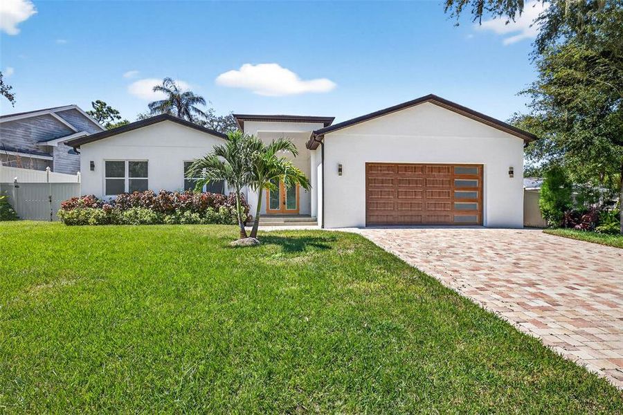 Front exterior of a new home in , Temple Terrace, FL, highlighting curb appeal (Image 1). Front exterior of a new home in , Temple Terrace, FL, highlighting curb appeal (Image 1).
