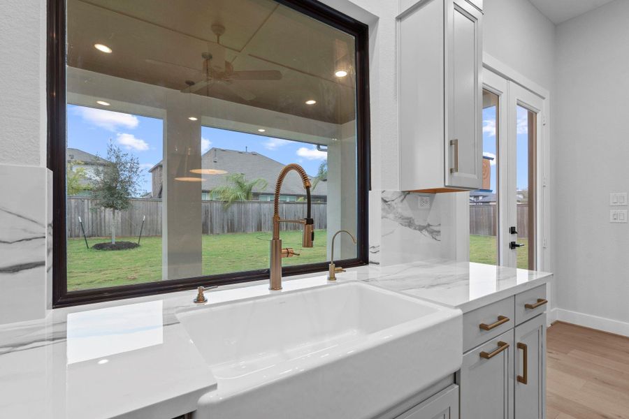 The sink is on the perimeter of the kitchen - not in the island! Look at that huge picture window!