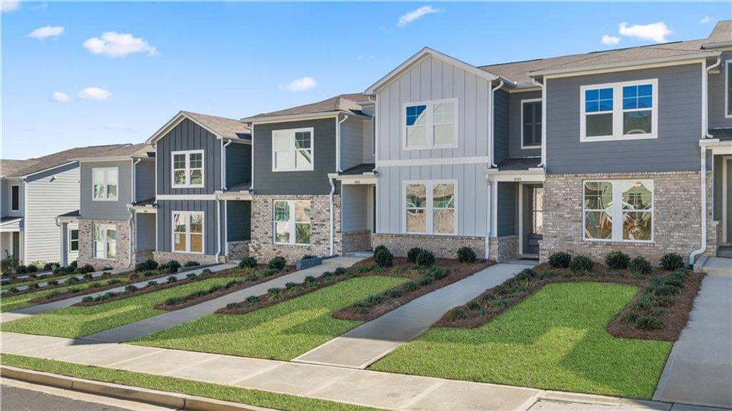 Front exterior of a new home in Stegall Village, Emerson, GA, highlighting curb appeal (Image 28). Front exterior of a new home in Stegall Village, Emerson, GA, highlighting curb appeal (Image 28).