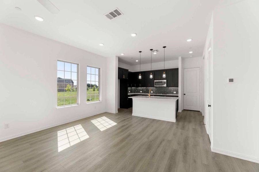 Open Kitchen-Living-Dining Room featuring the Noir Collection Open Kitchen-Living-Dining Room featuring the Noir Collection