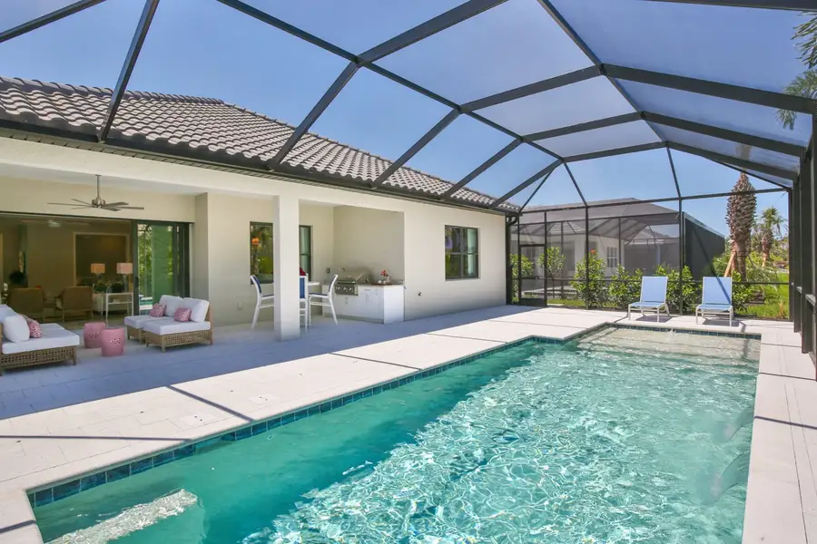 Exterior details and patio area of a home in Boca Royale Golf & Country Club at Wellen Park, Englewood (Image 4).