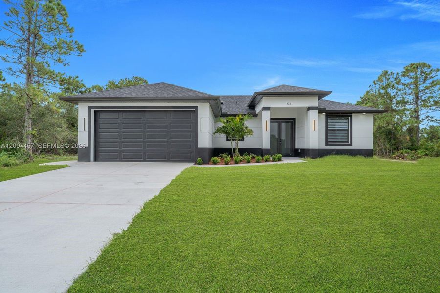 Front exterior of a new home in , Lehigh Acres, FL, highlighting curb appeal (Image 20). Front exterior of a new home in , Lehigh Acres, FL, highlighting curb appeal (Image 20).