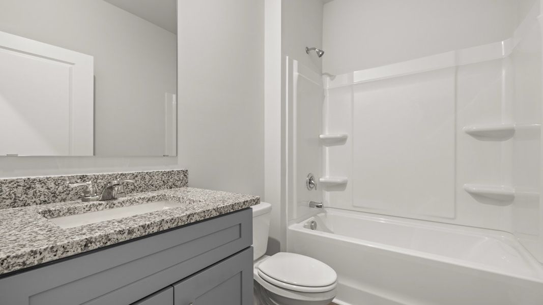 Representative furnished interior of a home built from the Halton by D.R. Horton in Highland Hills, Graniteville (Image 8).