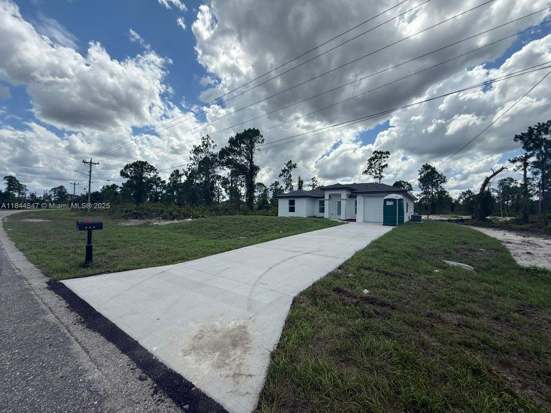 Front exterior of a new home in , Lehigh Acres, FL, highlighting curb appeal (Image 1). Front exterior of a new home in , Lehigh Acres, FL, highlighting curb appeal (Image 1).