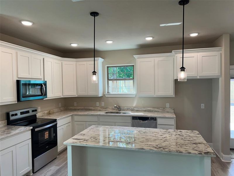 Kitchen with Island & SS Appliances