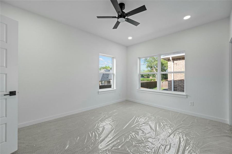 Spare room with light carpet, recessed lighting, and ceiling fan Spare room with light carpet, recessed lighting, and ceiling fan