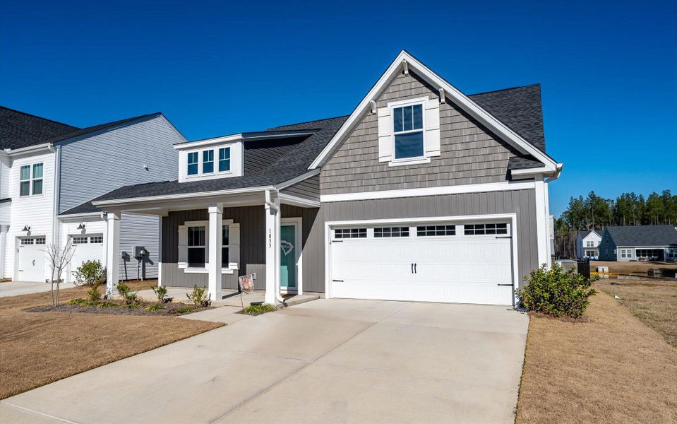 Front exterior of a new home in , Ravenel, SC, highlighting curb appeal (Image 21).