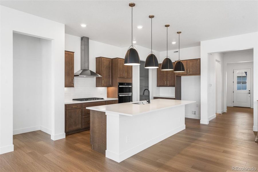 Furnished interior view inside a new home in Hilltop at Inspiration, Aurora (Image 6).